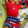 Niklaus joined the competition — help win amazing prizes! baby, baby_clothes, blanket, blue_shorts, celebration, child, colorful, cute, holiday_clothing, indoor, infant, lying_down, pacifier, patterned_clothing, plush_toy, portrait, red_shirt, soft_texture, spiderman, toddler