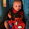 baby, blue, car_seat, child, child_seat, closeup, clothing, cute, fabric, indoor, infant, person, plush_toy, portrait, red, safety_harness, sitting, spiderman, toy, wide_eyes