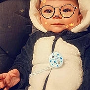 Nahel a rejoint le concours — aidez-le/la à gagner de superbes lots ! art, child, doll, eyewear, fashion_design, fun, fur, glasses, happy, personal_protective_equipment, plush, sitting, stuffed_toy, toddler, toy, vehicle_door, vintage_clothing, vision_care, winter, wool