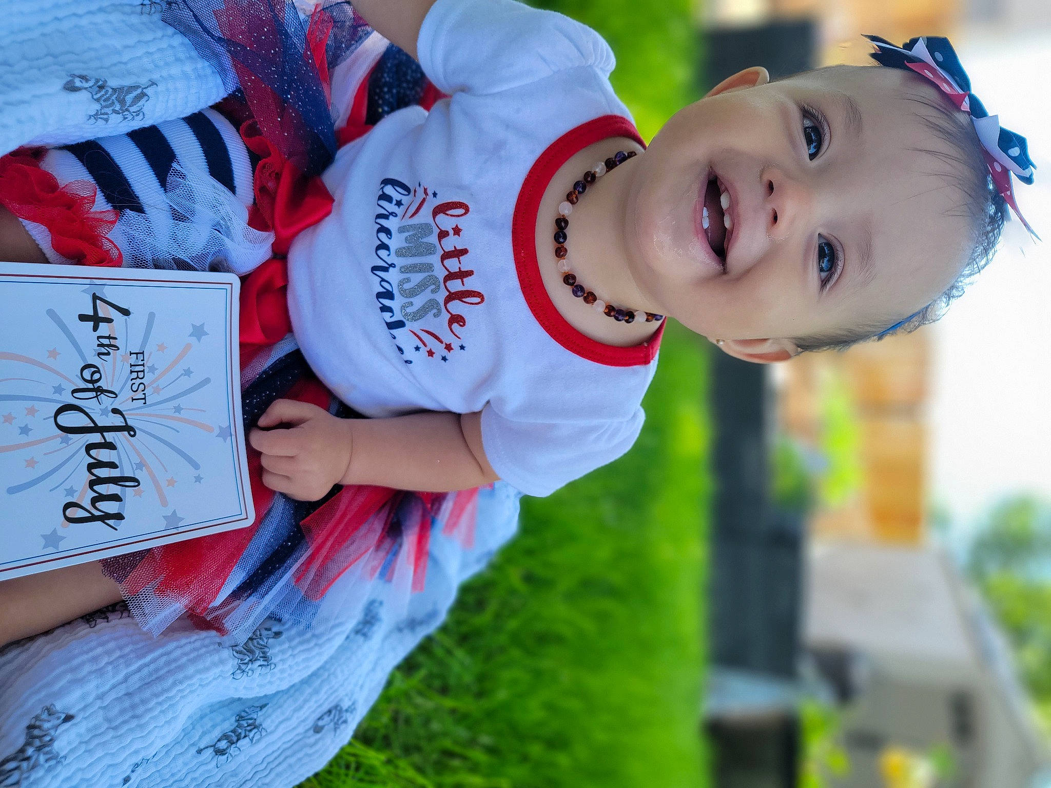 Zaylee is registered to the contest to win money with this photo: baby, baby_toddler_clothing, baseball_cap, cap, carmine, child, fun, grass, handwriting, happy, hat, joy, leisure, person, plant, recreation, sleeve, smile, summer, t_shirt