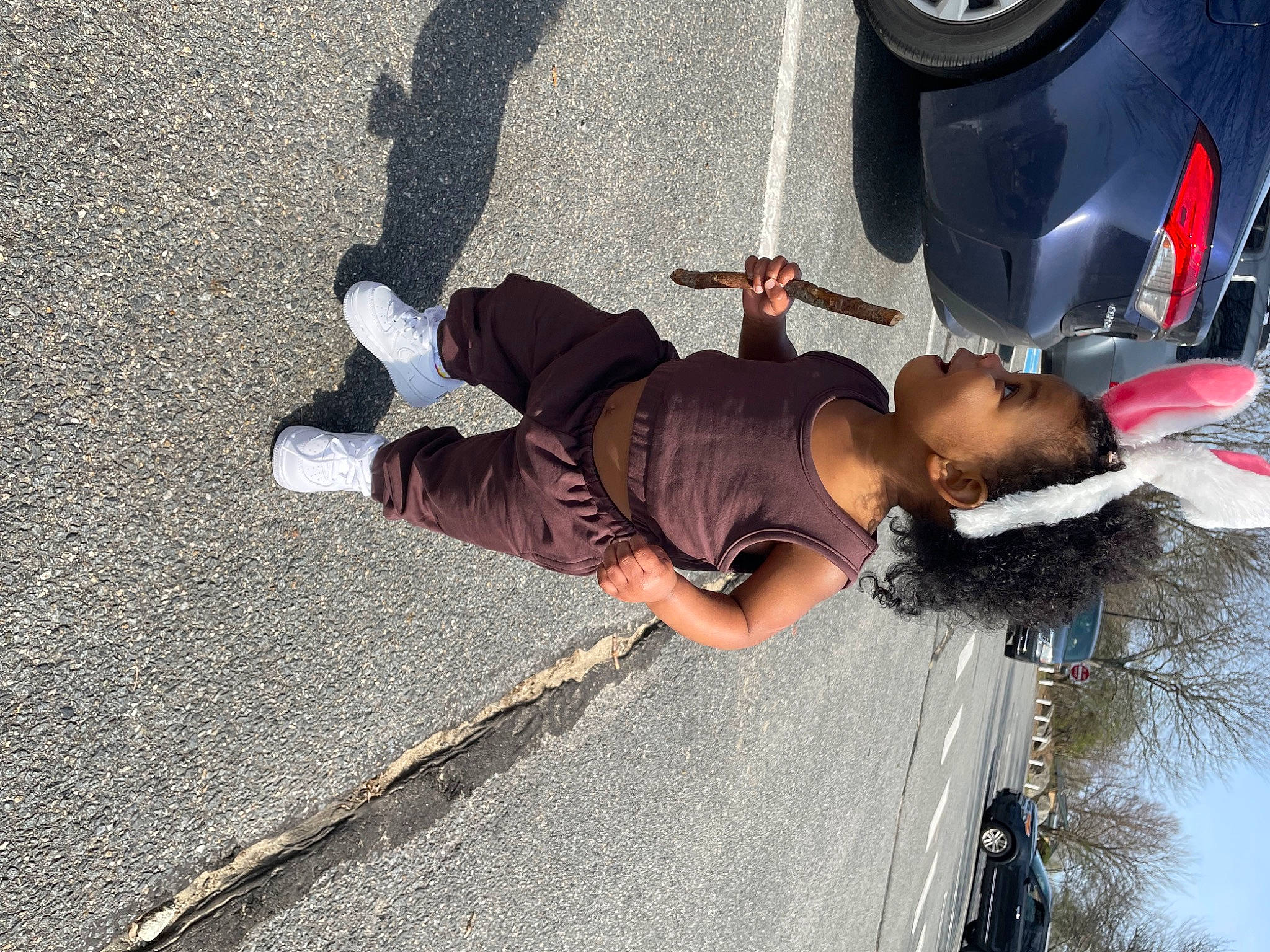 Ohana is registered to the contest to win money with this photo: asphalt, automotive_design, automotive_exterior, automotive_lighting, automotive_tire, automotive_wheel_system, car, hat, motor_vehicle, person, recreation, road, road_surface, shoe, sidewalk, sneakers, street_fashion, tire, vehicle, walking_shoe