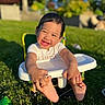 Antonio joined the competition — help win amazing prizes! toddler, child, smiling, high_chair, outdoor, grass, sunlight, happy, baby, person, portrait, feet, hands, greenery, daylight, playful, cute, nature, young_child, casual_clothing