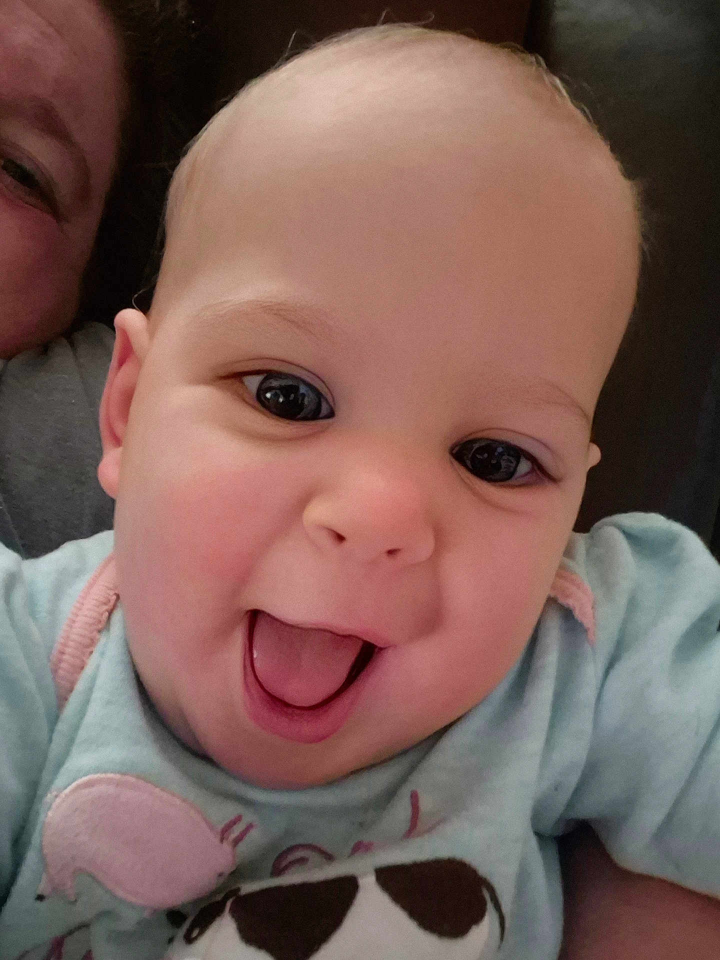 Rebecca is registered to the contest to win money with this photo: baby, infant, smile, happy, face, closeup, child, person, cute, joy, clothing, animal_print, pastel, eyes, mouth, skin, expression, portrait, head, human