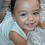 Andrew is registered to the contest to win money with this photo: baby, child, smiling, blue_eyes, curly_hair, crawling, white_rug, floor, indoors, cute, happy, close_up, infant, skin, person, toddler, playful, expression, young, cozy