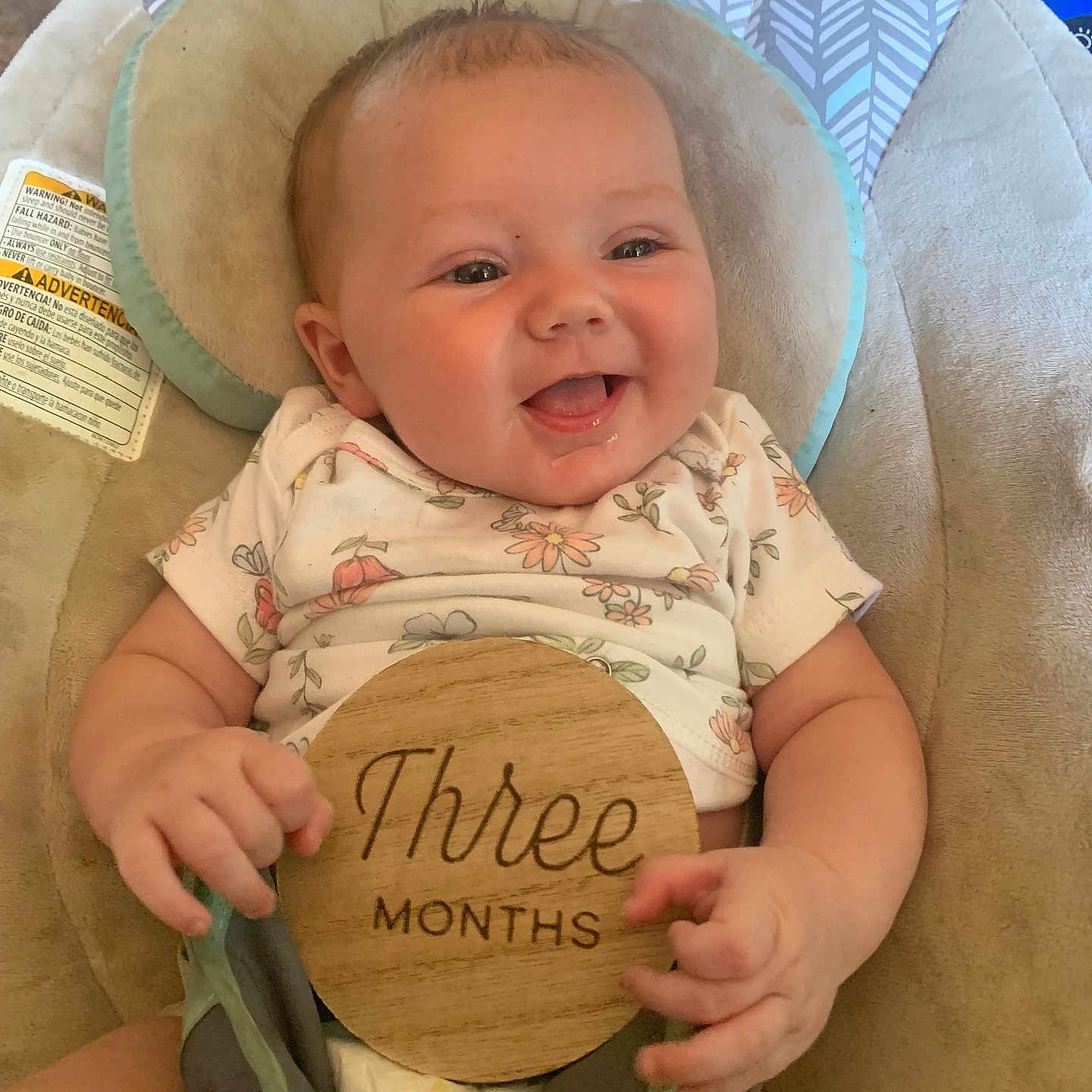 Wisteria is registered to the contest to win money with this photo: baby, baby_chair, child, comfort, cushion, cute, expression, floral_shirt, hand, happy, indoors, infant, person, portrait, sitting, skin, smiling, three_months, wooden_plaque, young