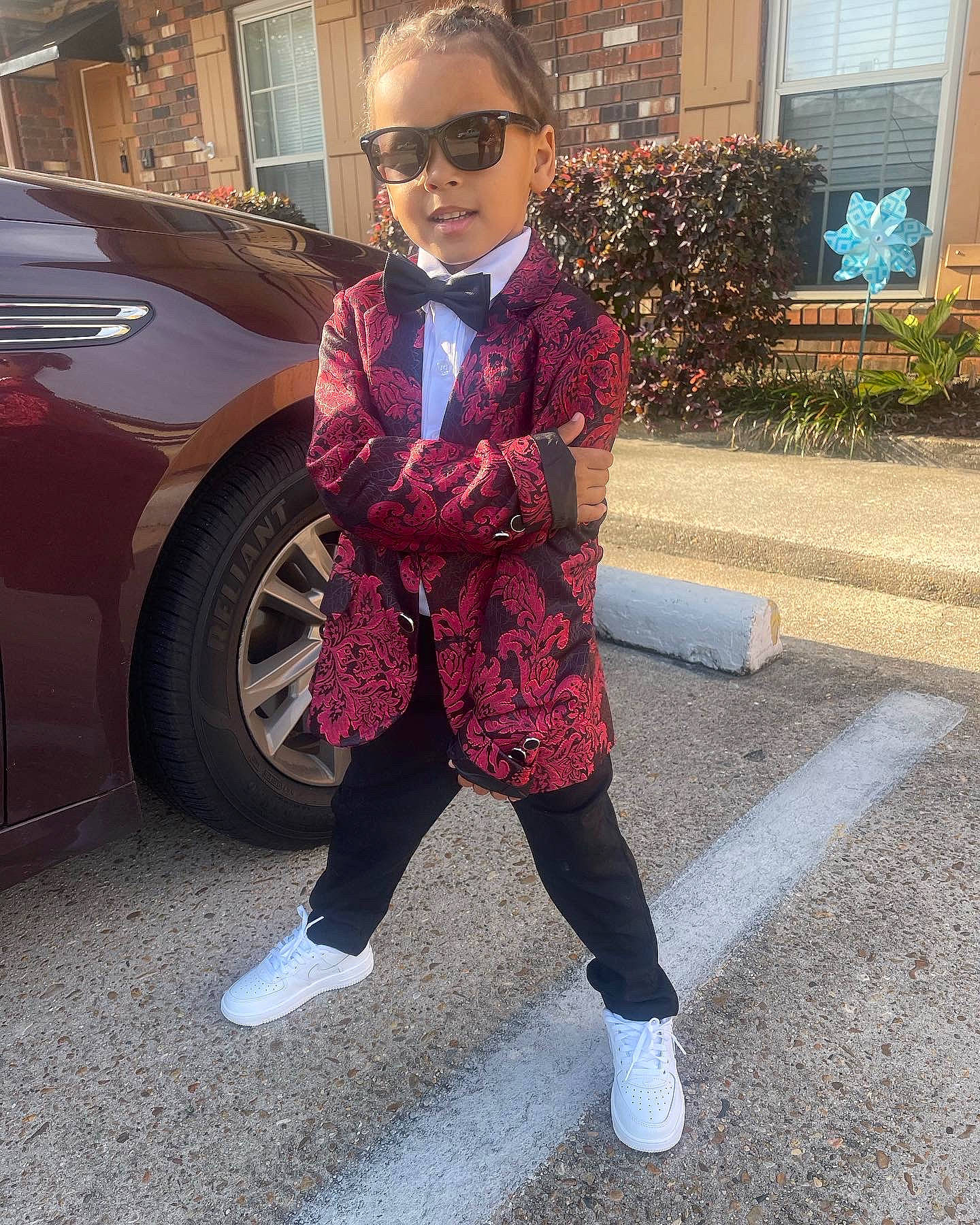 Avery is registered to the contest to win money with this photo: asphalt, automotive_design, blazer, car, cool, denim, electric_blue, eyewear, formal_wear, person, personal_luxury_car, plaid, plant, sleeve, sportswear, sunglasses, tire, vehicle_door, vision_care, waist