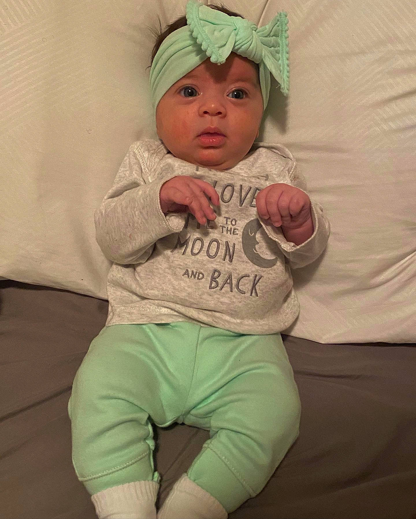 Sapphire is registered to the contest to win money with this photo: baby, cheek, child, headwear, person, sitting, skin, sleeve, smile, t_shirt, toddler