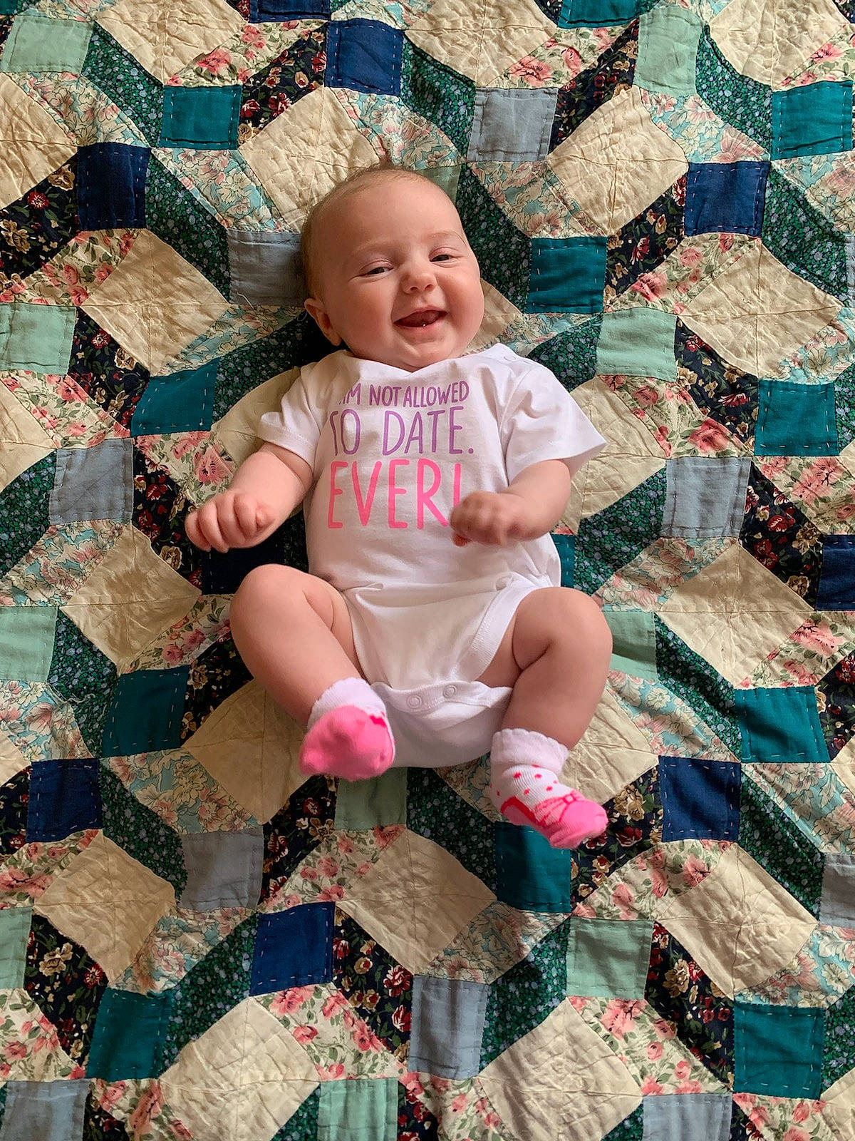 Mercedes is registered to the contest to win money with this photo: art, baby, bedding, cheek, child, craft, design, leg, linens, nap_mat, patchwork, pattern, person, photography, pink, quilt, quilting, sitting, textile, toddler