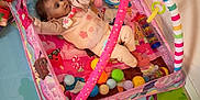 Solyana participe au concours pour gagner de l'argent avec cette photo : baby, infant, child, activity_gym, playpen, play_mat, toys, colorful, pink, onesie, rattle, plastic_balls, soft_toy, floor, indoor, mobile_toys, padded_mat, wall_socket, wood_floor, reaching_hand