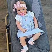 Adriana joined the competition — help win amazing prizes! baby, infant, pacifier, headband, bow, dress, blue_dress, socks, pink_socks, baby_rocker, gray_rocker, wooden_floor, cute, child, person, indoor, comfort, clothing, portrait, relaxing