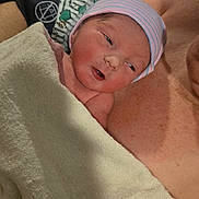 Anthony is registered to the contest to win money with this photo: newborn, baby, infant, blanket, hospital, cap, person, skin, arm, bed, resting, closeup, fresh, human, parent, family, tender, care, love, newborn_baby