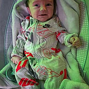 Anthony joined the competition — help win amazing prizes! baby, blanket, child, clothing, comfort, cute, expression, fabric, face, indoor, infant, newborn, onesie, pacifier, pattern, person, resting, sleeping_bed, soft, young