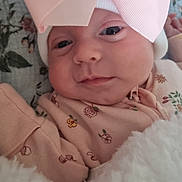 Millie-Rae joined the competition — help win amazing prizes! baby, infant, pink_bow, hat, blanket, floral_pattern, clothing, cute, face, portrait, newborn, soft, sleepwear, child, lying_down, closeup, skin, eyes, hand, warm