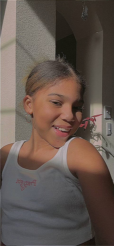 Zaliyah is registered to the contest to win money with this photo: active_tank, black_hair, blond, bun, camisoles, chest, chin, earrings, eyebrow, eyelash, fashion_design, flash_photography, houseplant, jaw, jewellery, joy, makeover, person, sleeveless_shirt, smile