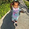 Nova joined the competition — help win amazing prizes! cars, child, clothing, daytime, expression, greenery, hair_bow, happy, outdoor, pacifier, person, shadow, shorts, sidewalk, sneakers, sunlight, toddler, trees, urban, walking