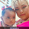 baby, woman, child, portrait, selfie, pink_clothing, makeup, bows, outdoor, daylight, pergola, family, bonding, head_and_shoulders, cute, person, smile, infant, closeup, casual