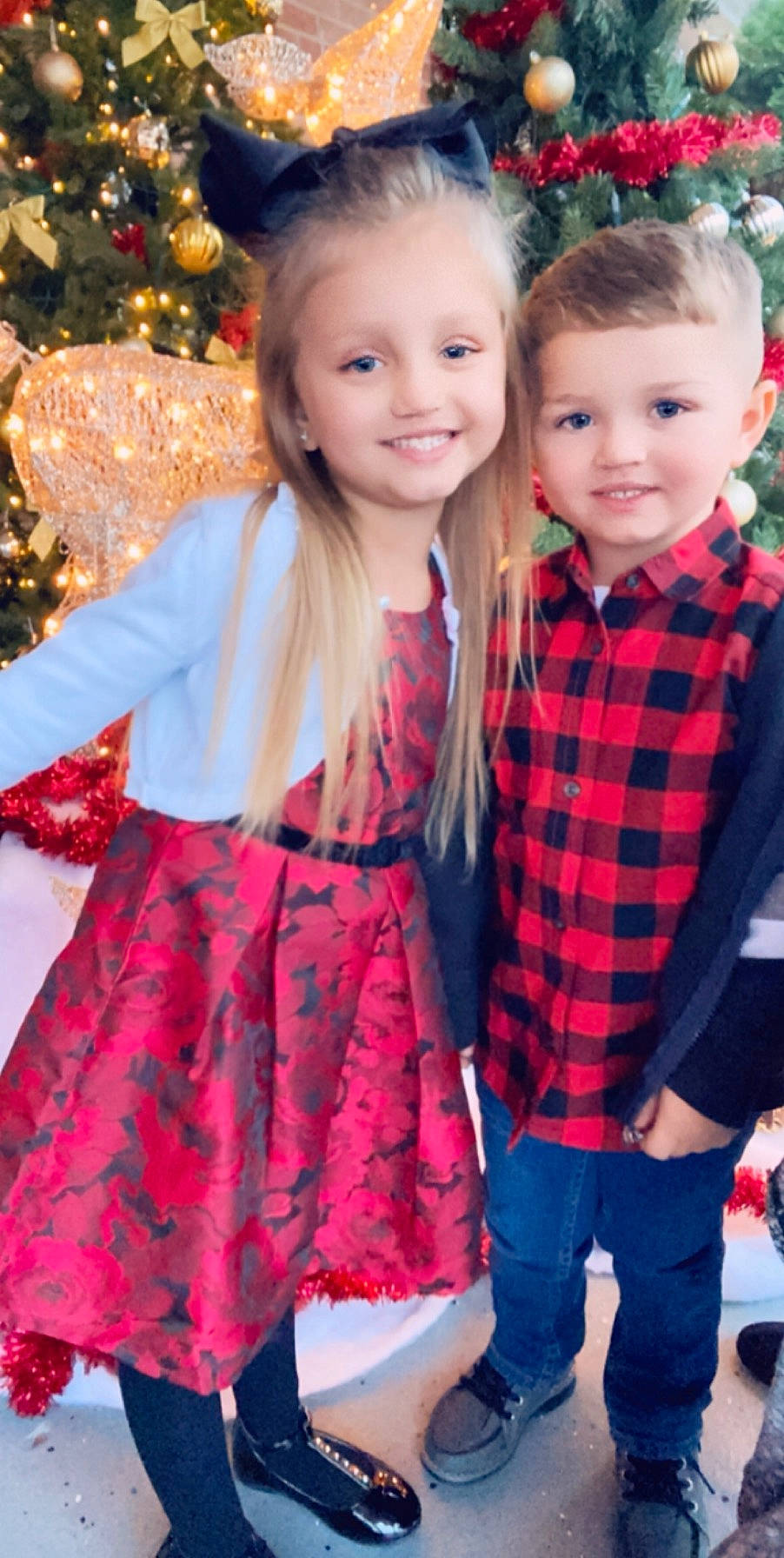 Karlee is registered to the contest to win money with this photo: baby_toddler_clothing, blond, child, christmas_decoration, clothing, denim, face, fashion, hair, happy, head, holiday, iris, joy, pattern, person, plaid, red, sleeve, smile