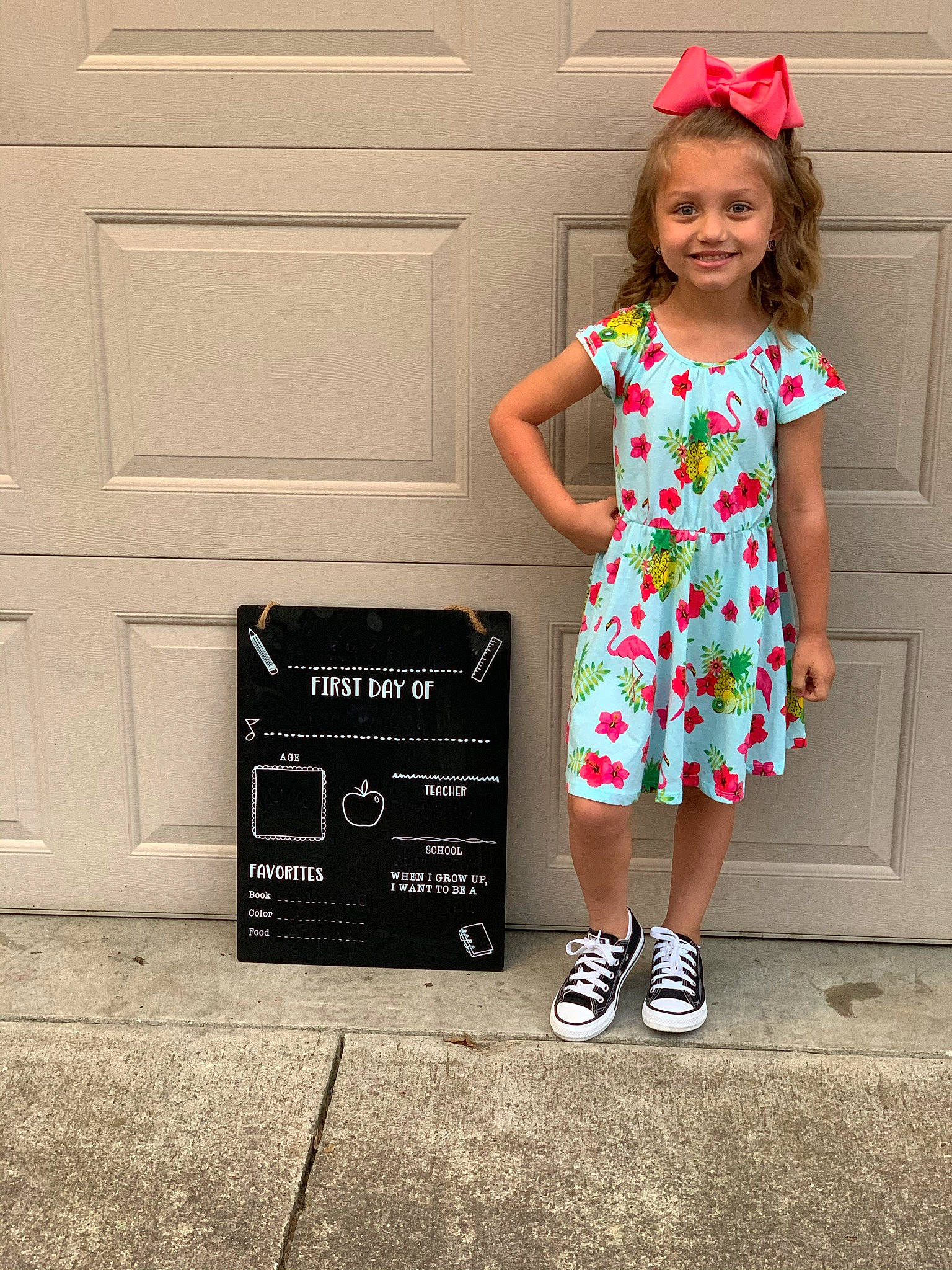 Karlee is registered to the contest to win money with this photo: baby_toddler_clothing, child, child_model, clothing, costume_accessory, costume_hat, day_dress, door, dress, embellishment, hair_accessory, happy, joy, one_piece_garment, pattern, person, pink, standing, toddler