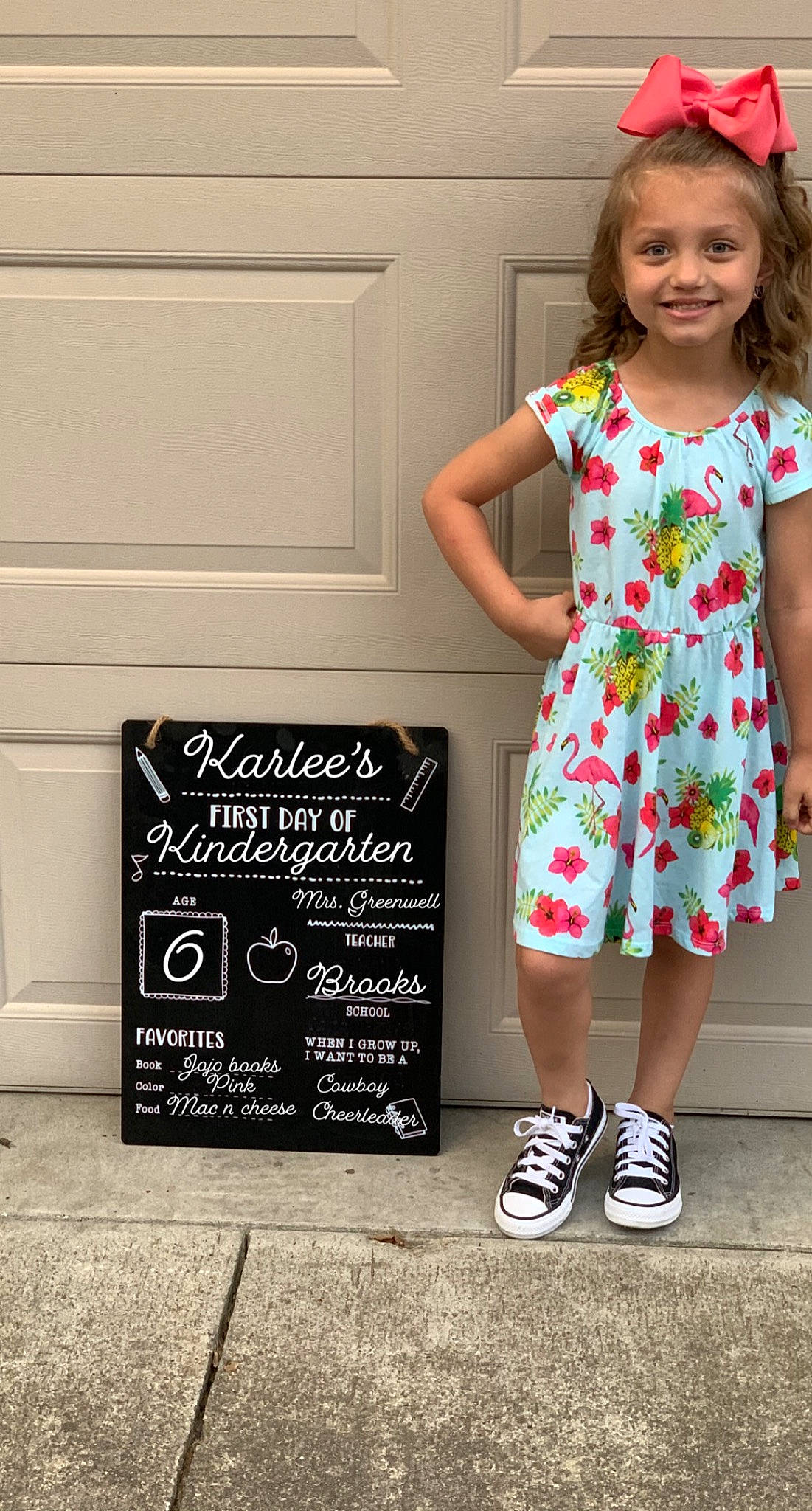 Karlee is registered to the contest to win money with this photo: baby_toddler_clothing, blackboard, chalk, child_model, clothing, day_dress, design, dress, embellishment, joy, one_piece_garment, pattern, person, shoe, slate, style, walking_shoe