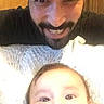 Josh joined the competition — help win amazing prizes! baby, infant, adult, man, father, parent, family, selfie, portrait, smiling, beard, face, eyes, blanket, indoor, home, close_up, cozy, family_photo, photography