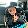  안전, backseat, boy, car, car_seat, child, clothing, daylight, electronic_device, hands, happy, indoors, passenger, portrait, seatbelt, short_hair, smiling, tablet, travel, vehicle