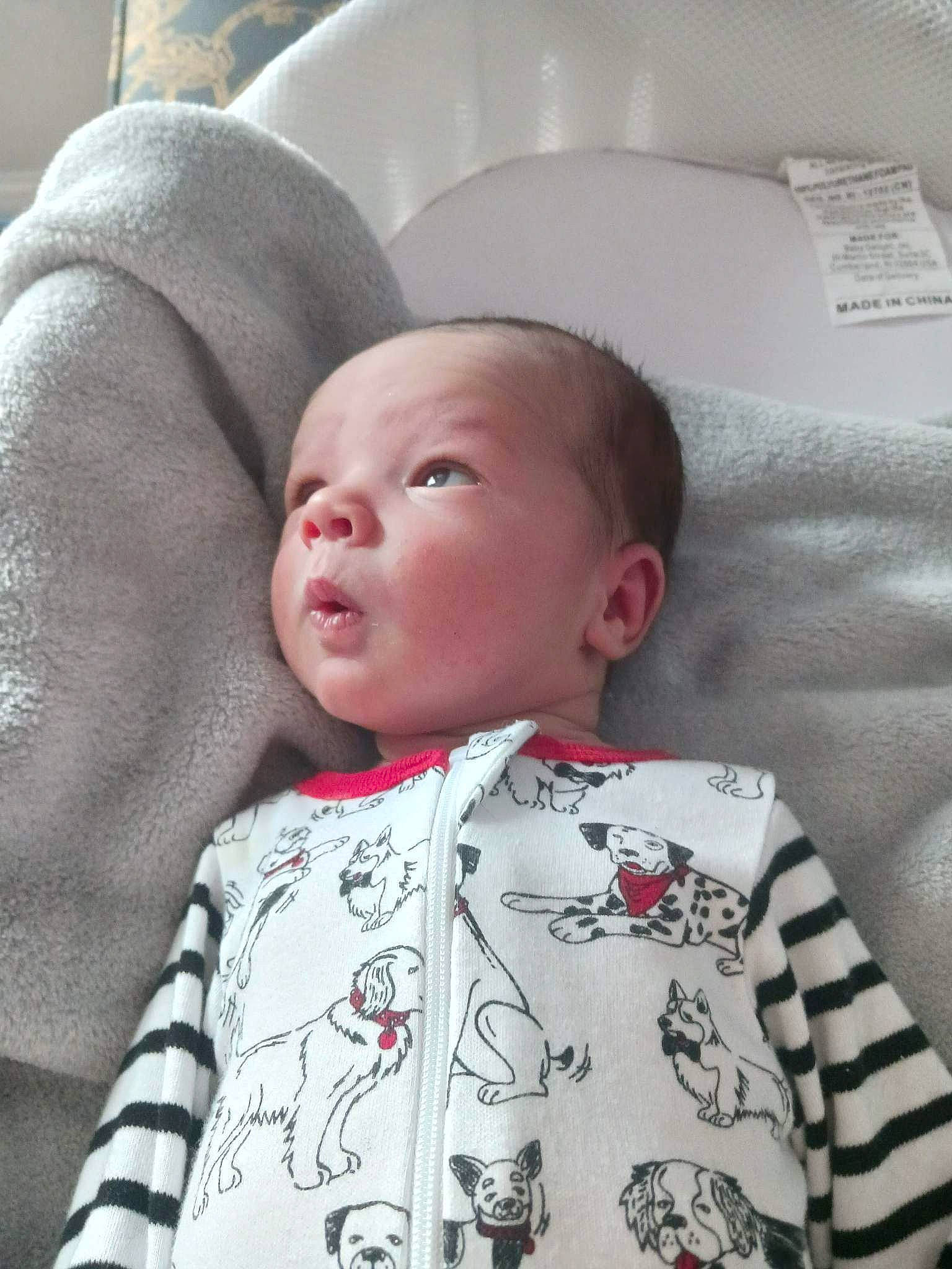 Tobi is registered to the contest to win money with this photo: baby, baby_toddler_clothing, cheek, chin, collar, comfort, eye, eyebrow, hair, head, iris, linens, lip, mammal, mouth, nose, person, skin, sleeve, toddler