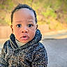 casual, child, closeup, curious, cute, expression, face, fall, head_and_shoulders, knitwear, natural_light, outdoor, person, portrait, seasonal, sweater, toddler, warm_clothing, young_child, young_face