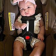 Mallory joined the competition — help win amazing prizes! baby, car_seat, child, infant, pink_bow, headband, straps, white_outfit, sandals, indoor, seat, cute, child_safety, adorable, portrait, baby_girl, clothing, face, person, young_child
