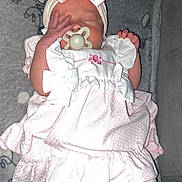 Harmony-Grace is registered to the contest to win money with this photo: baby, infant, sleeping, pink_dress, headband, bow, pacifier, blanket, leggings, cute, child, sleep, indoors, soft, cozy, newborn, pattern, fabric, resting, peaceful