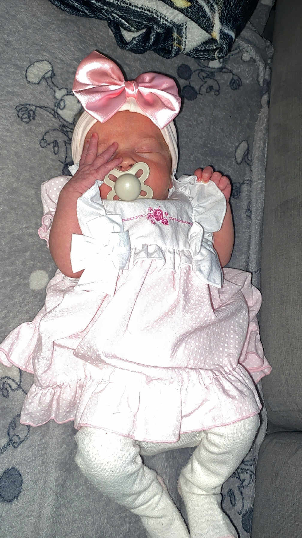 Harmony-Grace is registered to the contest to win money with this photo: baby, infant, sleeping, pink_dress, headband, bow, pacifier, blanket, leggings, cute, child, sleep, indoors, soft, cozy, newborn, pattern, fabric, resting, peaceful