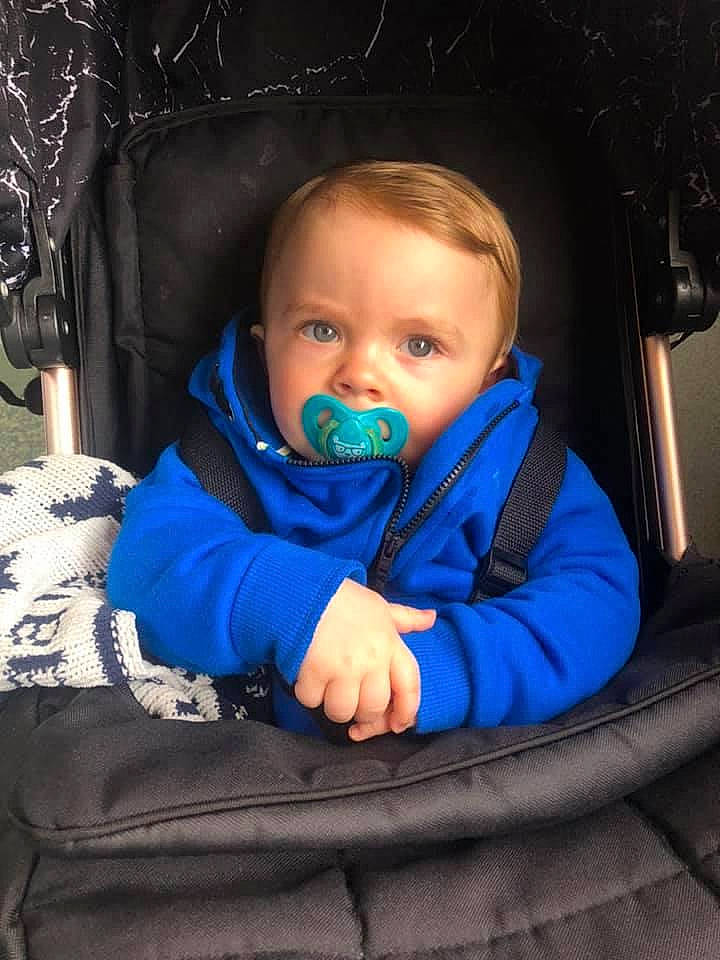 Leighton is registered to the contest to win money with this photo: azure, baby, baby_toddler_clothing, cheek, child, comfort, cool, electric_blue, eye, facial_expression, flash_photography, fun, happy, head, iris, mouth, organ, people, person, product