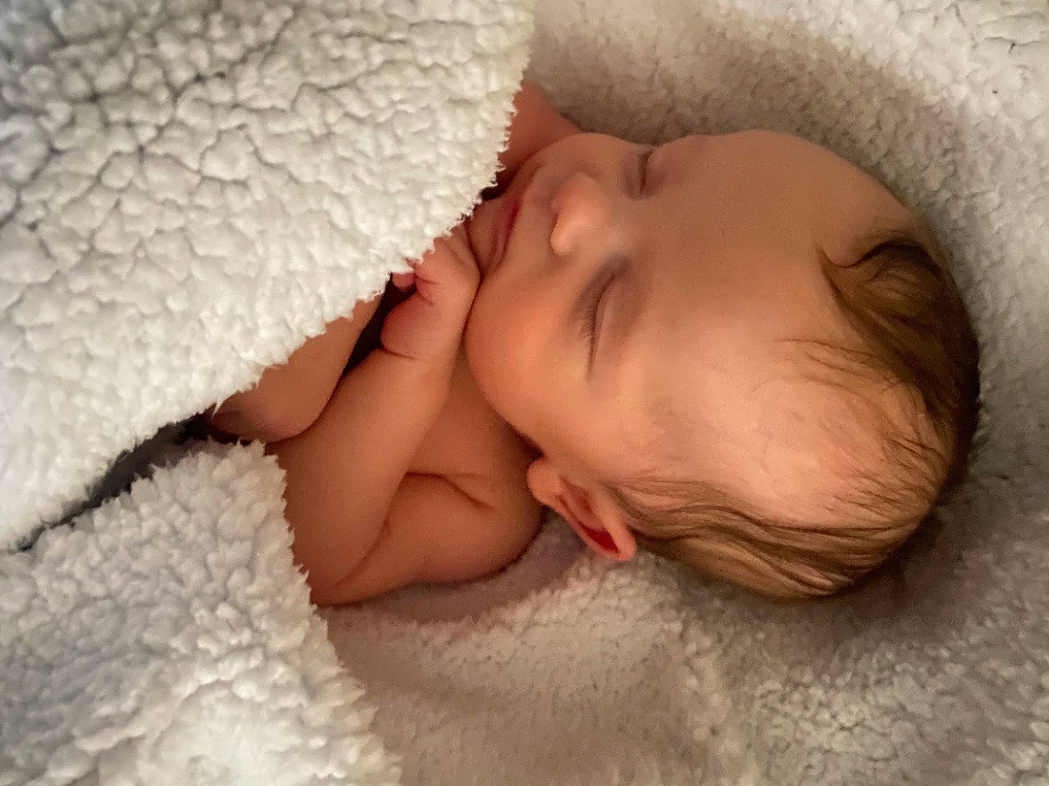 Kayne is registered to the contest to win money with this photo: arm, baby, baby_sleeping, baby_toddler_clothing, bed, bedding, cheek, child, close_up, comfort, ear, eyelash, finger, headgear, linens, nose, person, skin, textile, toddler
