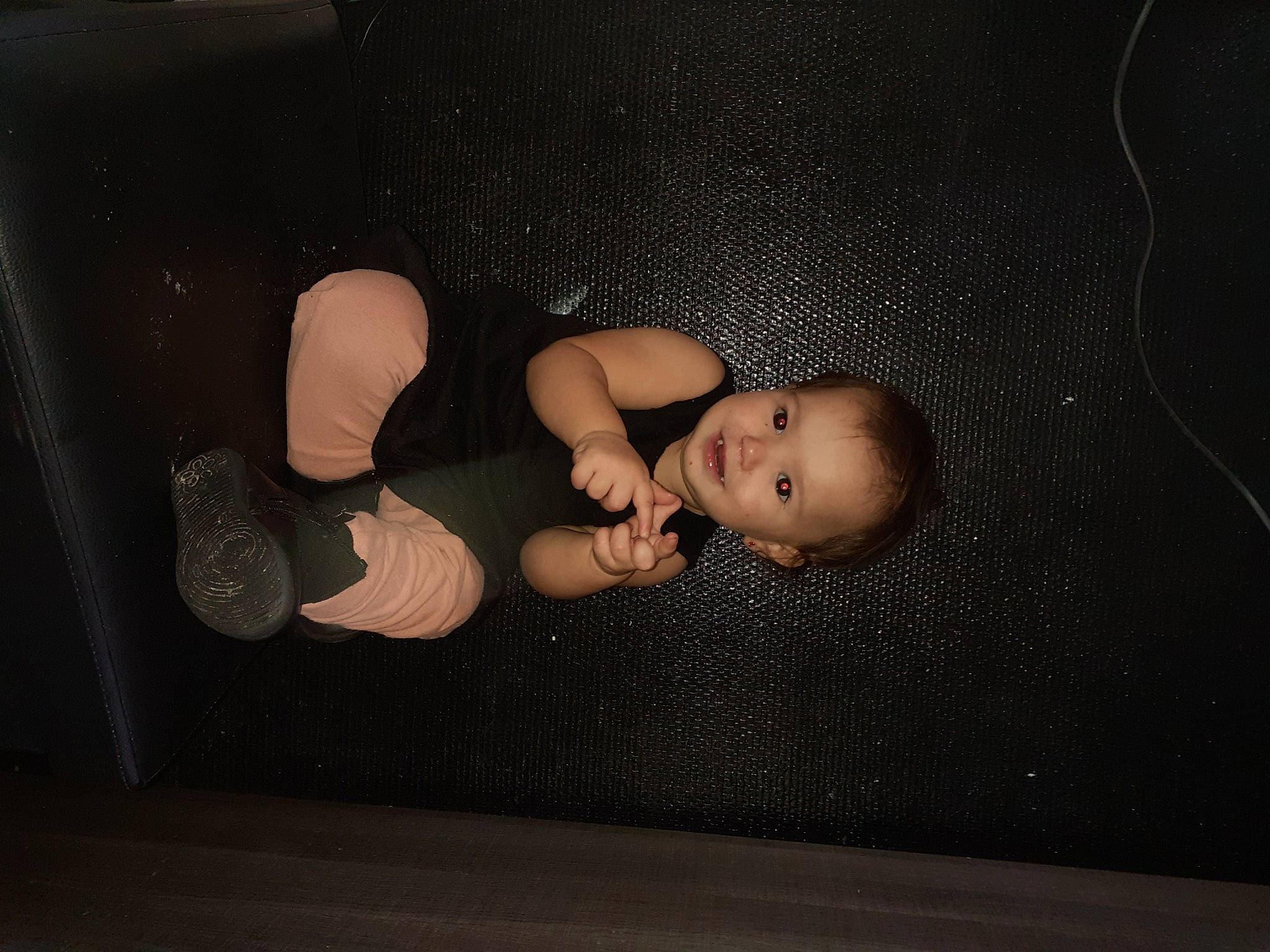 Matina participe au concours pour gagner de l'argent avec cette photo : auto_part, cheek, child, darkness, doll, finger, flash_photography, flooring, foot, gesture, head, headgear, human_body, joy, leg, person, plastic, room, space, still_life_photography