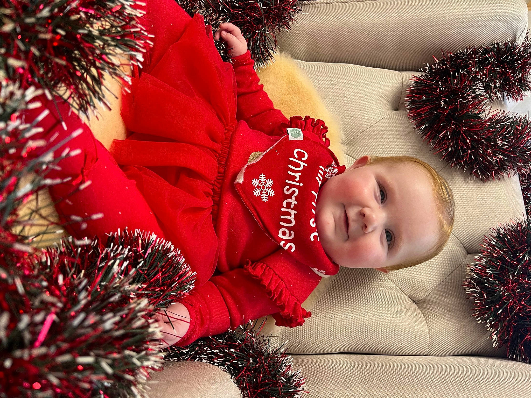 Sophie joined the competition — help win amazing prizes! carmine, christmas, christmas_decoration, christmas_eve, christmas_ornament, decoration, event, facial_expression, happy, head, holiday, joy, ornament, people, person, plant, product, red, smile, toddler