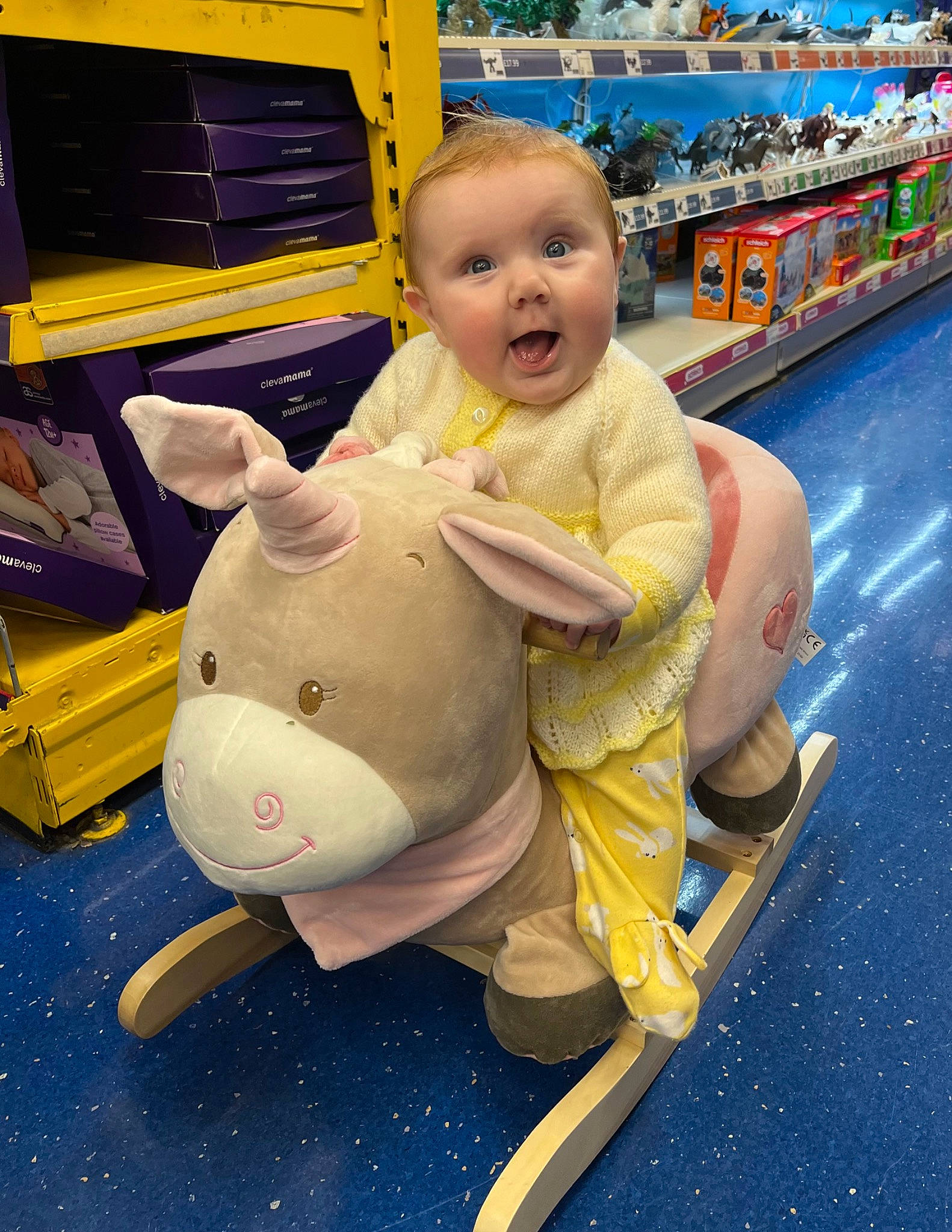 Sophie is registered to the contest to win money with this photo: baby, child, event, fun, happy, leisure, metal, motor_vehicle, person, play, recreation, sitting, smile, surprise, toddler, toy, transport, travel, yellow