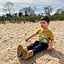 Sohrab joined the competition — help win amazing prizes! bare_tree, boots, casual_clothing, child, curious, daytime, grass, leisure, nature, outdoor, park, playful, relaxed, sand, sitting, sky, sunlight, trees, tshirt, young_boy