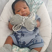 Dēmarii joined the competition — help win amazing prizes! baby, infant, blue_onesie, mittens, socks, baby_seat, cushion, sleepy, cute, newborn, indoor, portrait, child, soft_toys, fabric, comfort, resting, small_hands, small_feet, relaxed