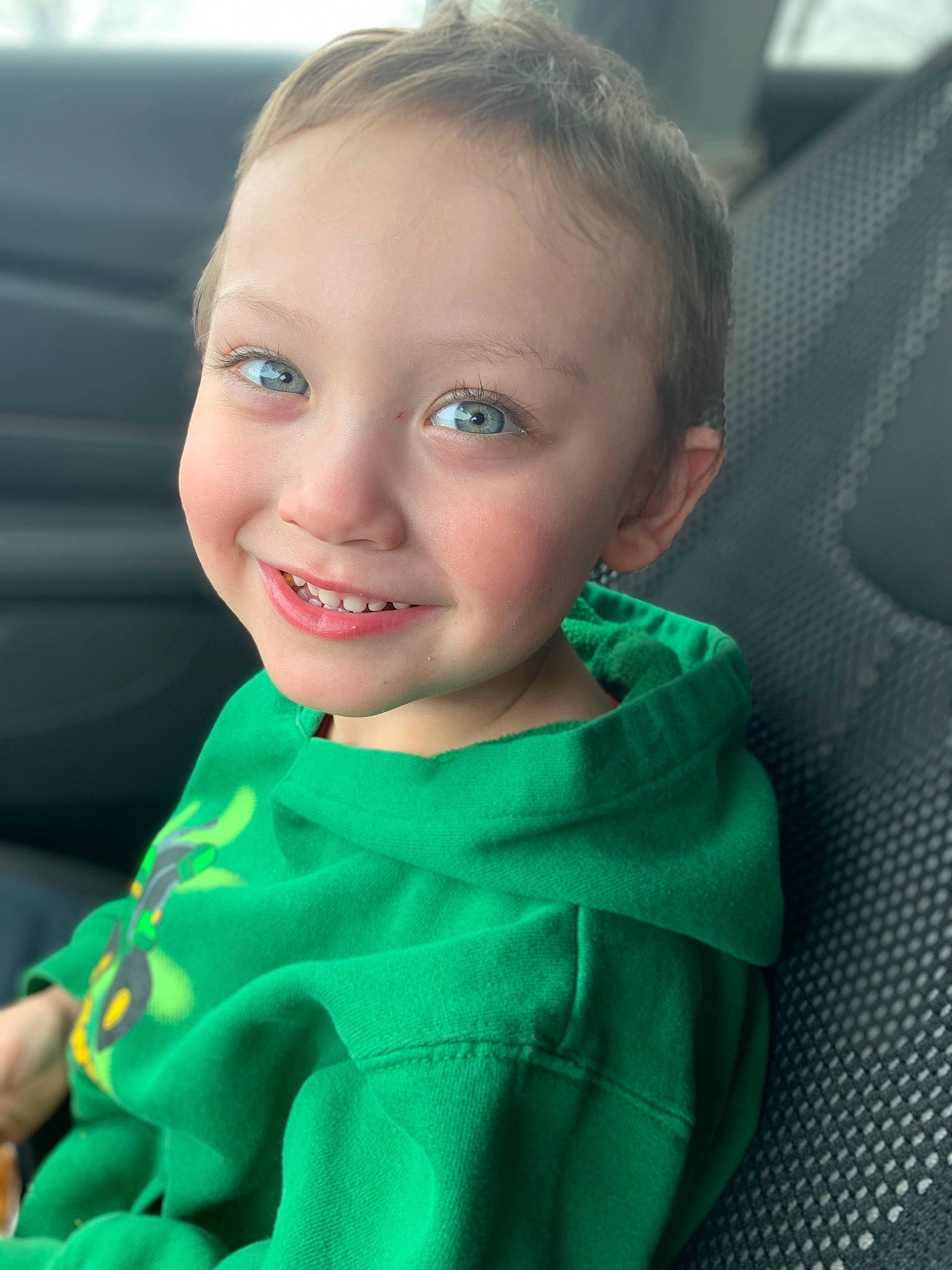 Jaxen is registered to the contest to win money with this photo: baby, blond, cheek, child, chin, eye, face, facial_expression, forehead, fun, green, head, iris, joy, lip, mouth, nose, outerwear, person, skin