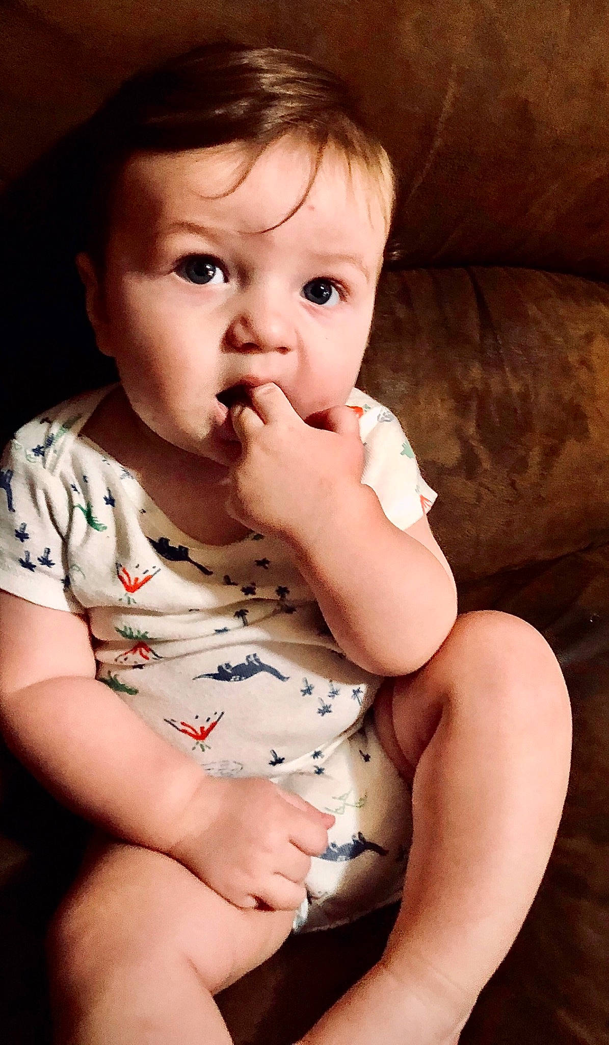 Marcus is registered to the contest to win money with this photo: abdomen, baby, baby_toddler_clothing, cheek, child, couch, eyelash, finger, hand, human, lip, living_room, nail, person, skin, sofa_bed, stomach, studio_couch, thumb, toddler