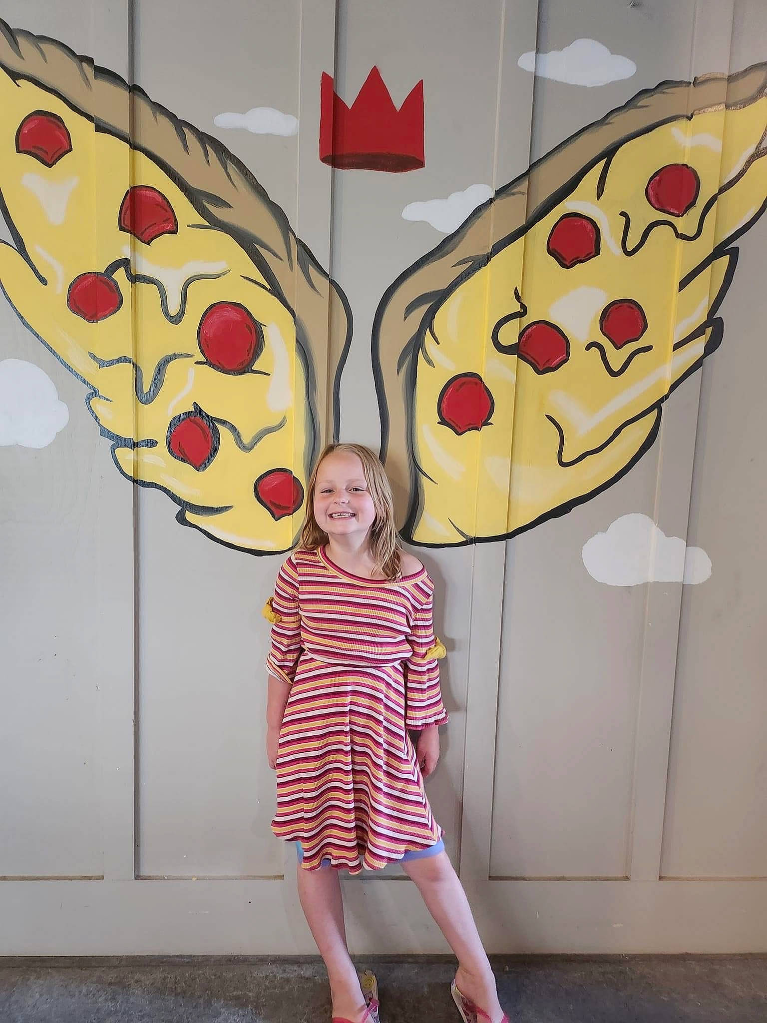 Clara is registered to the contest to win money with this photo: art, design, dress, event, font, fun, happy, joy, line, organ, pattern, person, photograph, red, sandal, smile, snapshot, symmetry, visual_arts, wall