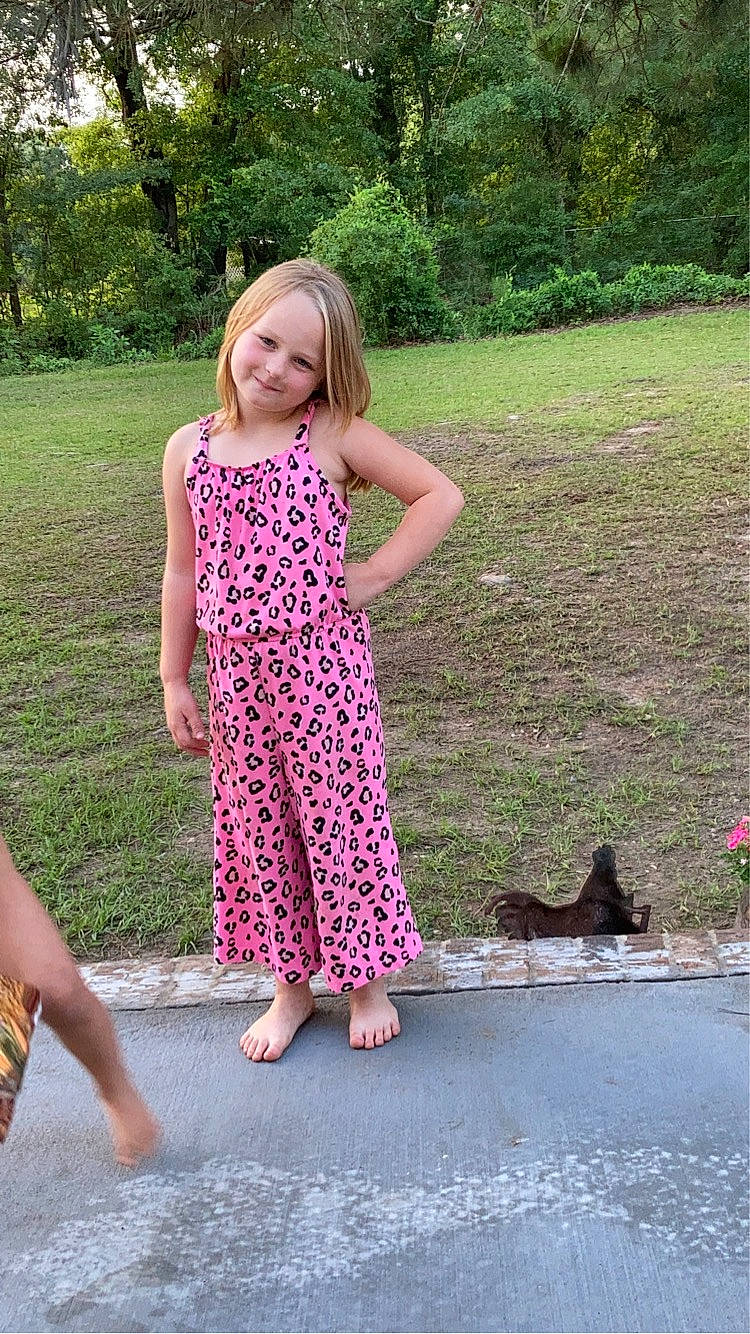 Clara joined the competition — help win amazing prizes! barefoot, botany, day_dress, fun, garden, grass, happy, human_leg, joy, leisure, magenta, one_piece_garment, pattern, people_in_nature, person, pink, plant, sandal, smile, summer