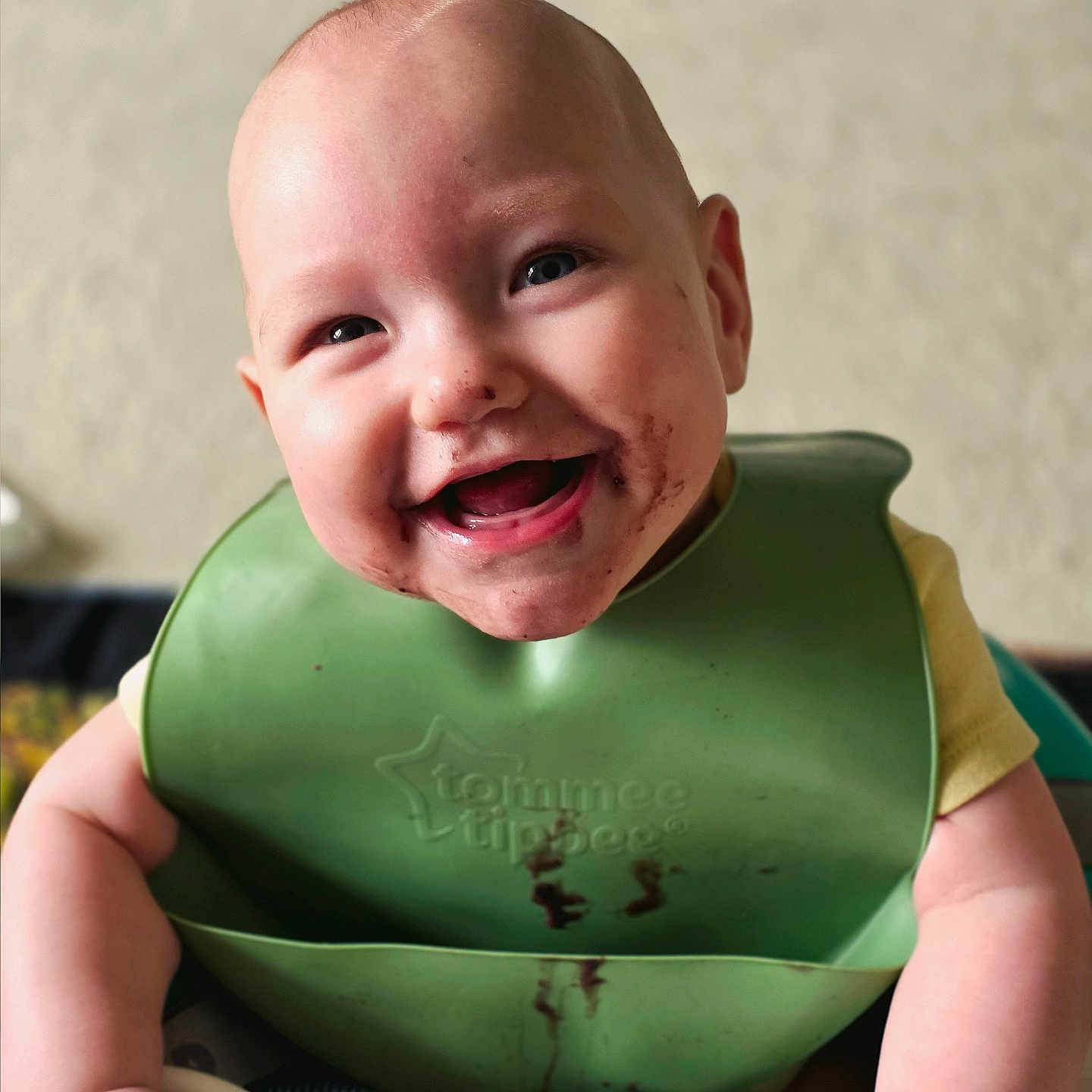 Aurora is registered to the contest to win money with this photo: arms, baby, bib, child, chocolate, cleaning, cuteness, eating, face, food, happy, highchair, indoor, infant, joy, messy, mouth, playful, skin, smiling