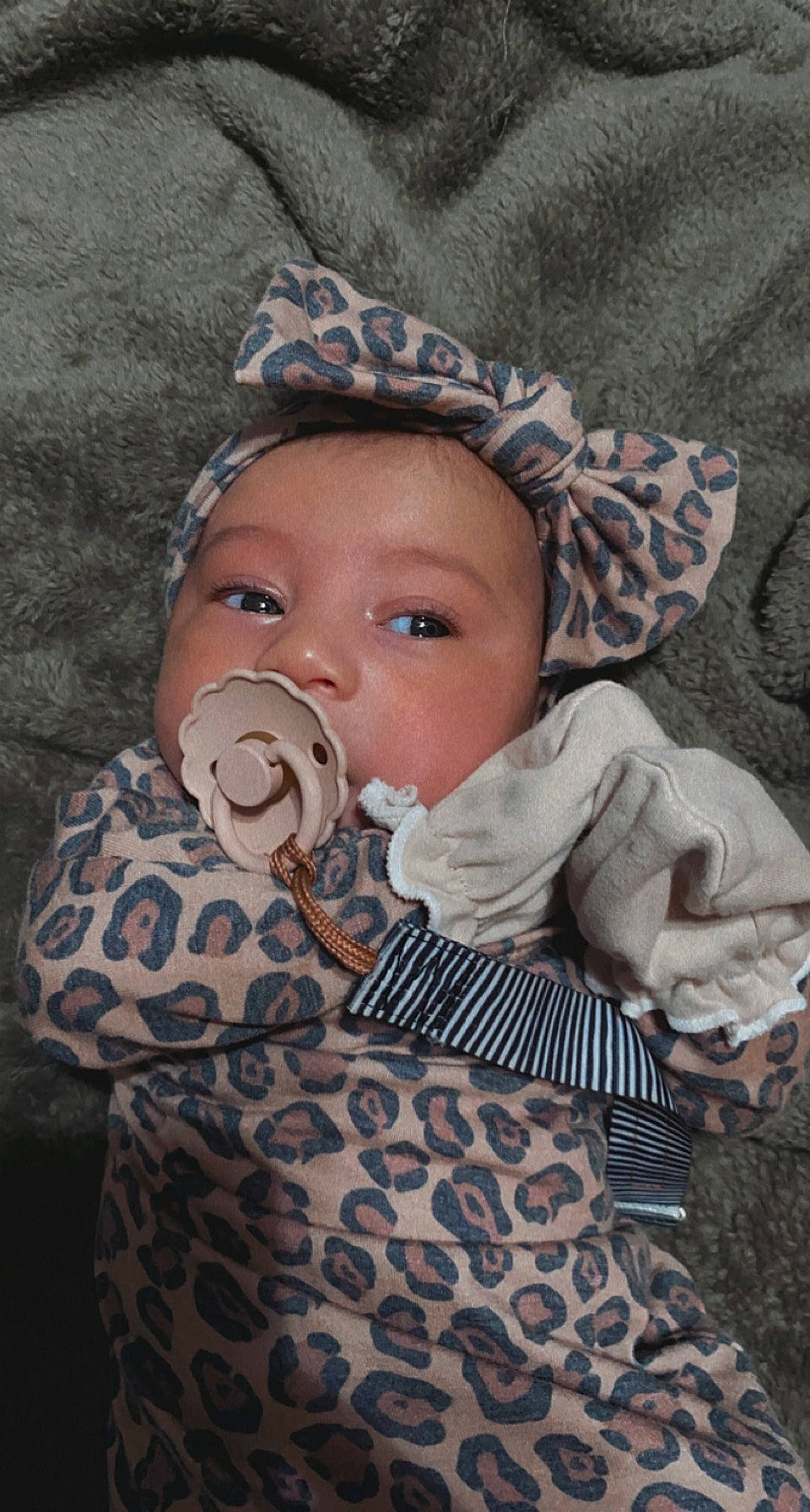 Briella joined the competition — help win amazing prizes! baby, baby_toddler_clothing, cap, cheek, child, eye, eyelash, face, fashion_accessory, fun, grass, head, headwear, iris, nose, pattern, person, personal_protective_equipment, plant, sitting