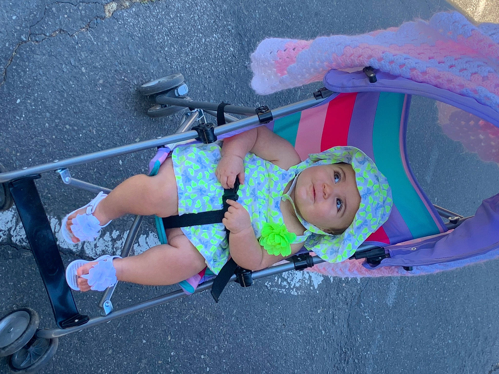 Giavanna is registered to the contest to win money with this photo: asphalt, baby, baby_carriage, baby_products, child, electric_blue, fun, headwear, human_leg, knee, leisure, person, recreation, smile, thigh, toddler, vacation