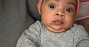 Blakelea joined the competition — help win amazing prizes! baby, infant, face, headwear, beanie, clothing, gray_outfit, curious_expression, wide_eyes, indoors, blanket, soft_texture, pink, person, child, cute, portrait, closeup, hands, seated