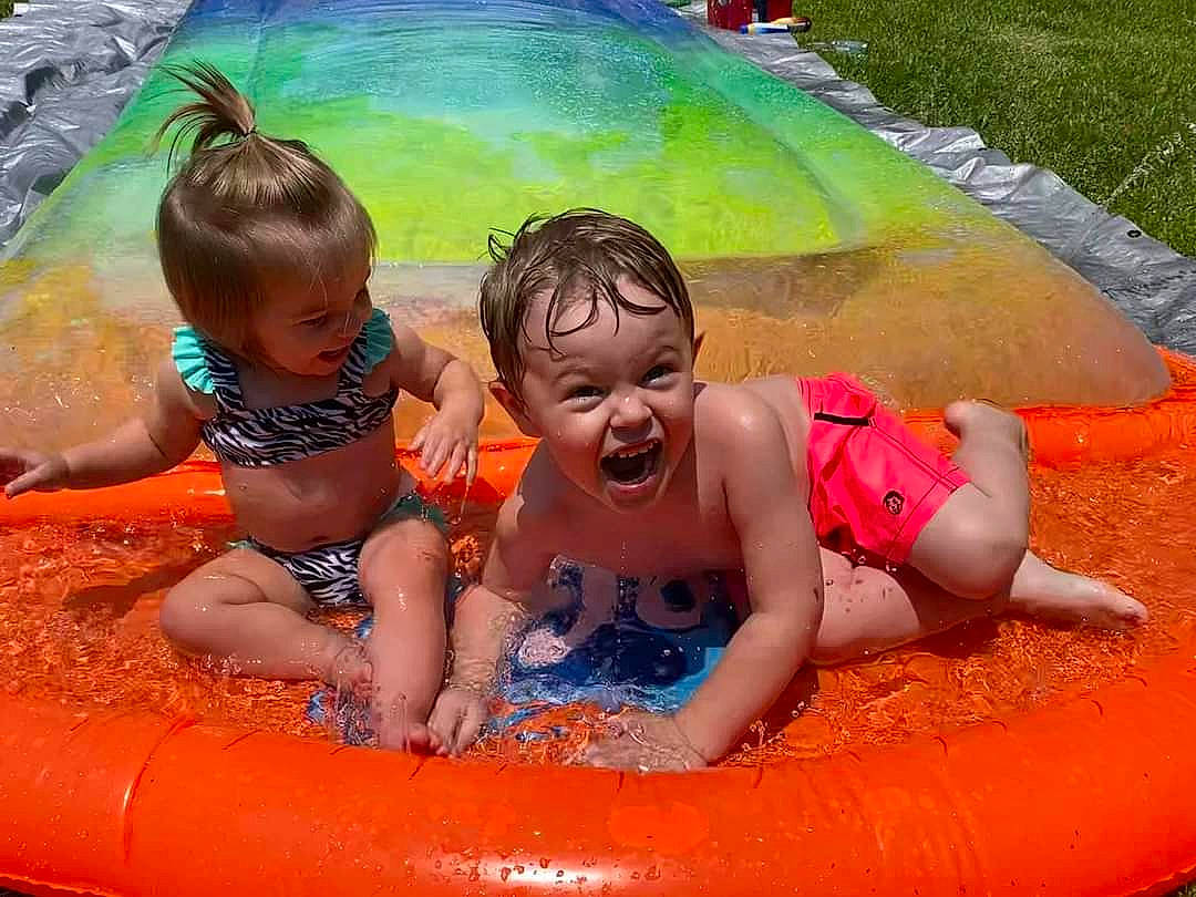 Nathen joined the competition — help win amazing prizes! baby, bathing, child, fun, games, grass, green, happy, head, inflatable, leisure, person, photograph, play, playing_with_kids, recreation, smile, snapshot, summer, toddler