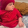 Zaviyar is registered to the contest to win money with this photo: baby, infant, red_hat, red_shirt, white_pants, bed, pillow, blanket, indoors, cute, child, sitting, clothing, soft_lighting, portrait, skin, hand, foot, expression, cozy