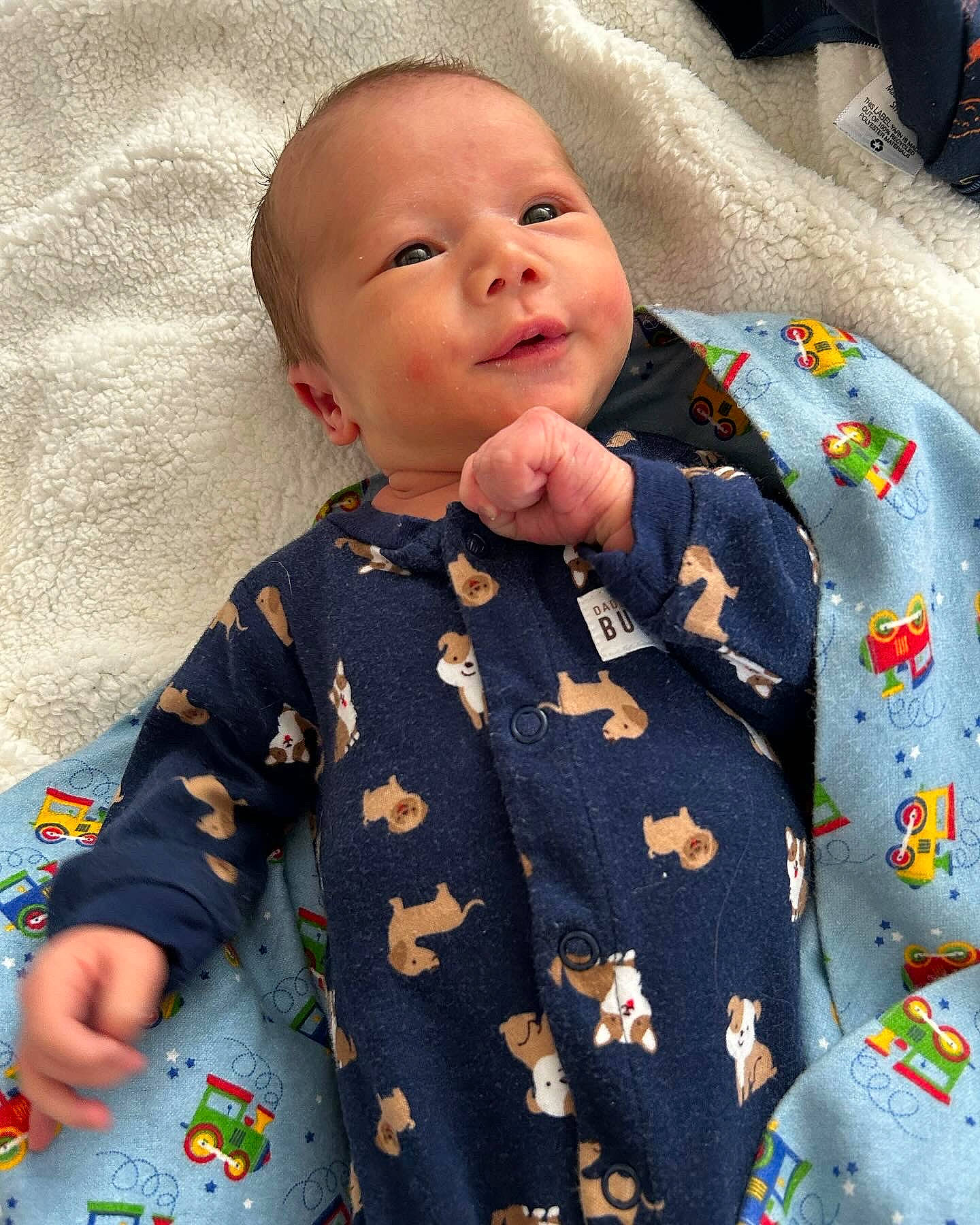 Kyro is registered to the contest to win money with this photo: baby, baby_products, baby_toddler_clothing, bedding, button, child, collar, comfort, happy, linens, nightwear, pattern, people, person, room, sitting, skin, sleeve, smile, t_shirt