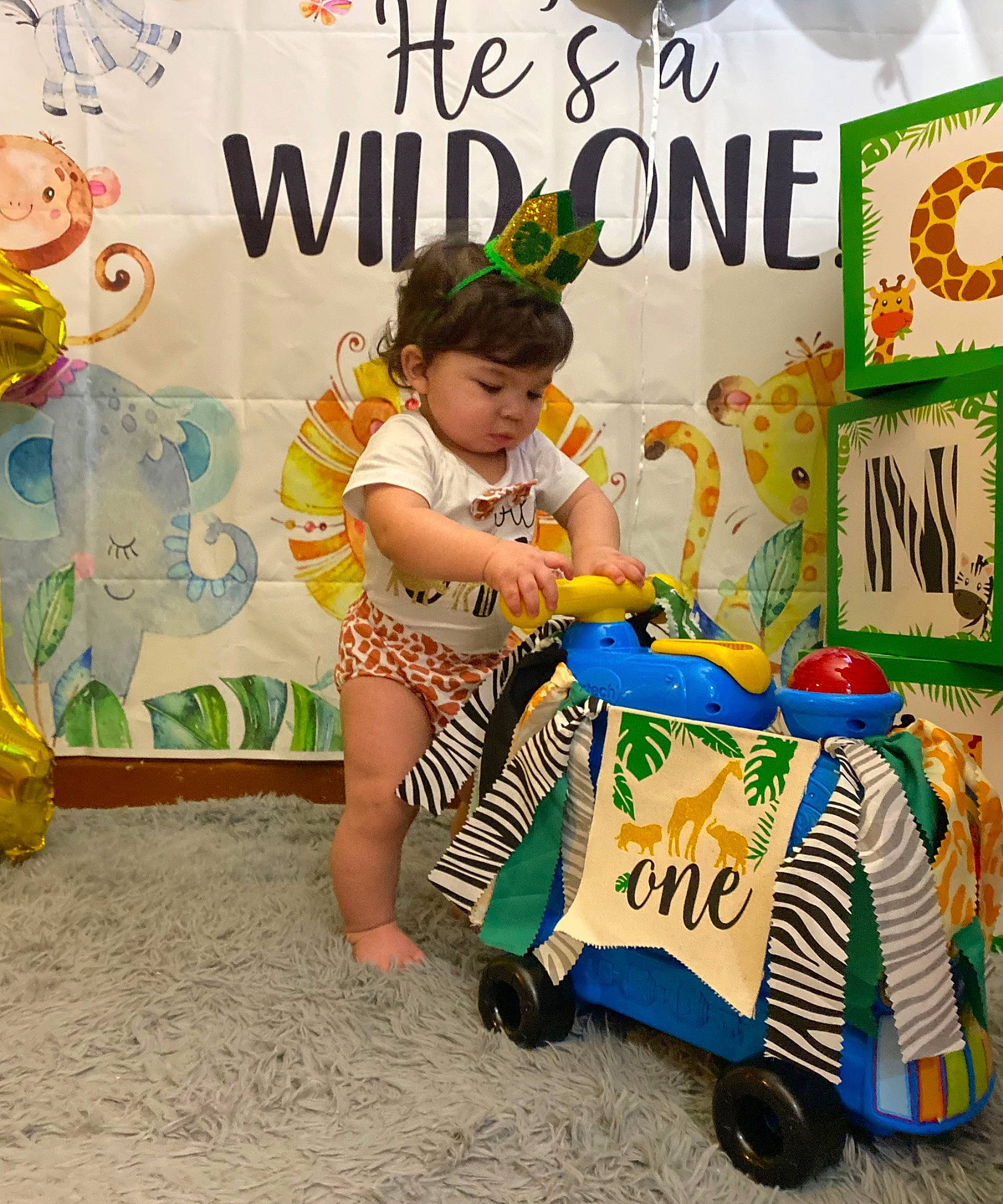 Jaxx Phoenix is registered to the contest to win money with this photo: advertising, child, event, fashion_design, font, fun, happy, hat, leisure, motor_vehicle, person, poster, publication, recreation, riding_toy, room, sitting, tire, toddler, visual_arts