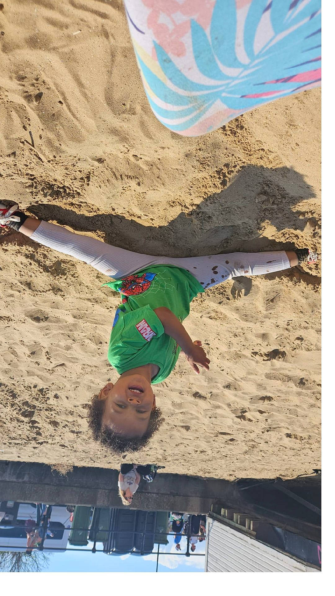 Omario is registered to the contest to win money with this photo: beach, child, clothing, coast, face, female, girl, head, nature, outdoors, person, photography, portrait, sea, shoreline, shorts, soil, summer, t_shirt, water